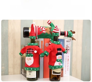 Detail of Christmas wine bottle covers featuring Santa, Snowman and Reindeer embroidery