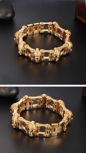 Macro shot of gold stainless steel bike chain bracelet with Buddha head embossing detail