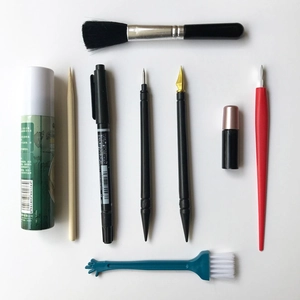 9-piece scratch art tool set with brushes, pens, and scrapers for precision painting