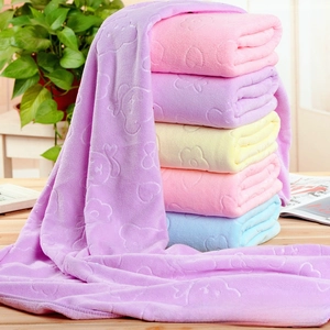 Close-up of embossed bear and heart patterns on colorful microfiber bath towels
