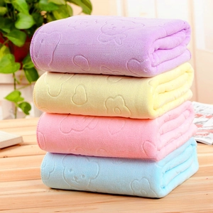 Stack of four colorful microfiber towels with embossed bears on a wooden surface