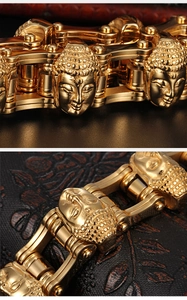 Macro shot of gold stainless steel bicycle chain bracelet featuring detailed Buddha head links