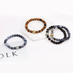 Tiger eye and lava stone beaded bracelets with gold and silver leopard head charms