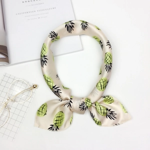 Chic cream square neck scarf with green pineapple pattern and glossy silk satin texture