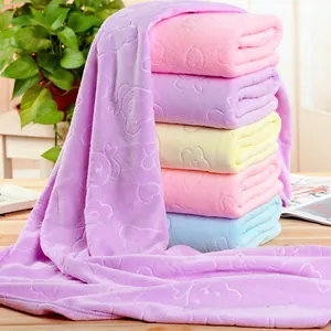 Detailed view of embossed bear and heart patterns on thick microfiber bath towels