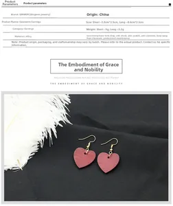 Detalle de pendientes de corazón rojo oscuro en diseños de aleación asimétrica