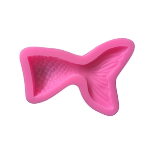 Pink silicone mermaid tail mold for fondant and chocolate baking on white background