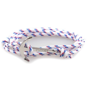 Detail of hand-woven red white and blue striped rope bracelet with silver VIKINGS anchor clasp