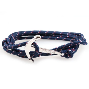 Detailed shot of silver Vikings anchor clasp on a tricolor woven nautical rope bracelet