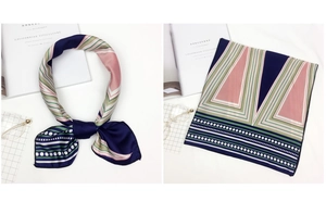 Detail view of navy blue satin square scarf with colorful stripes and polka dot patterns
