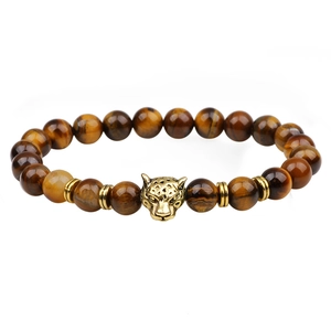Men's tiger eye beaded bracelet featuring a gold leopard head charm on white background