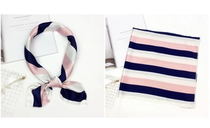 Pink and navy striped satin neck scarf displayed with stylish magazine and eyewear props