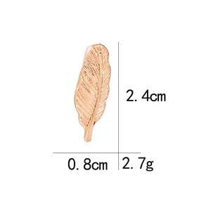Detailed view of rose gold feather brooch with dimensions 2.4cm x 0.8cm and weight 2.7g