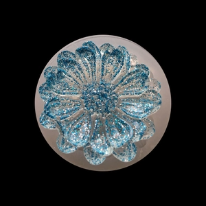 Blue glitter resin daisy flower DIY mold accessory on a white base with black background