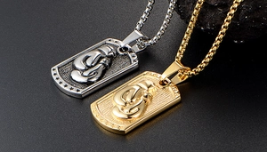 Detail of boxing glove pendants in gold and silver finish on sleek box chains