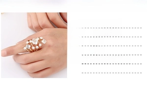 Close-up of gold-plated fashion spring ring with crystals and rhinestones details