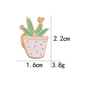 Detailed size view of a cartoon cactus enamel pin with measurements 2.2cm and 1.6cm