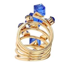 Detail of multi-layer gold spiral ring featuring blue cube crystals and adjustable band
