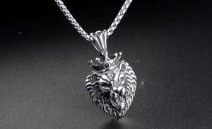 Macro shot of silver stainless steel lion head pendant with crown and braided wheat chain