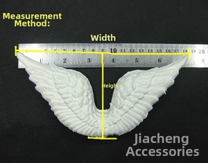 Detailed view of white angel wing decorations with measurements showing size and width