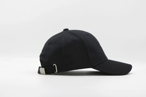 Detail view of breathable black cotton baseball cap with silver metal adjustable buckle