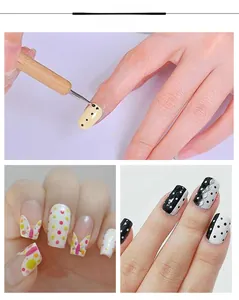 Détail d'un outil de pointage en bois créant des motifs colorés pour le nail art