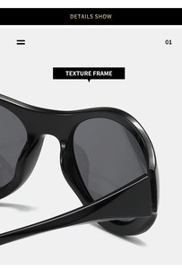 Macro view of glossy black Y2K sunglasses showcasing the thick texture frame design