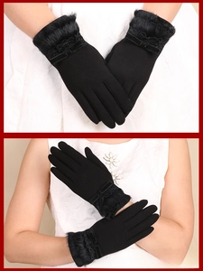 Detail of winter gloves featuring elegant lace, bow decor, and plush faux fur cuffs