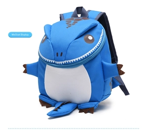 Detail view of 3D dinosaur backpack for kids with blue oxford fabric and brown scales