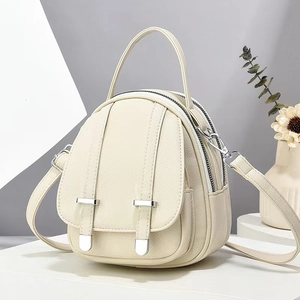 Minimalist cream white mini crossbody backpack with multi-layer zipper and silver hardware