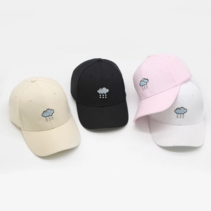 Detailed view of cloud embroidery on adjustable breathable cotton baseball caps in four colors