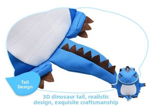 Detail showing the 3D dinosaur tail and reinforced stitching on blue kids backpack