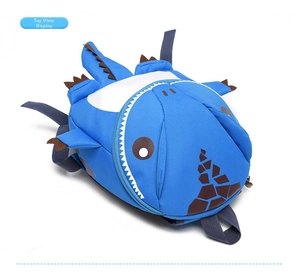 Top view of a blue cartoon dinosaur backpack for kids with 3D spines and adjustable straps