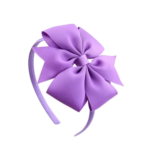 Lavender purple grosgrain ribbon headband with a large bow for kids on white background