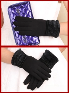 Detailed view of black thermal gloves with lace trim and elegant faux fur cuffs