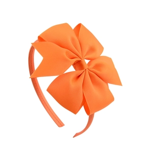 Bright orange grosgrain ribbon bow headband for kids and women, centered on white background