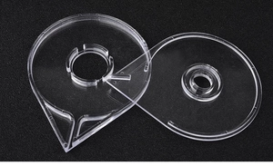 Detail view of transparent acrylic nail art striping tape dispensers with precise guide holes