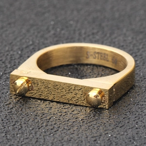 Macro shot of 18K gold titanium steel ring with double rivets and S-STEEL engraving