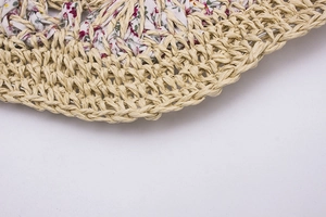 Handmade straw sun hat with floral lining detail and foldable woven texture