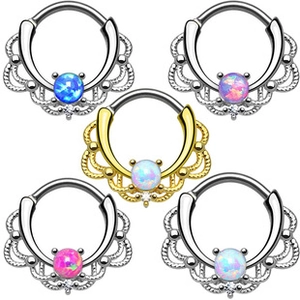 Macro shot of five assorted opal nose rings in silver and gold metal finishes