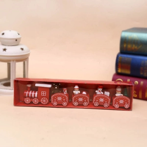 Detailed view of a red wooden Christmas train featuring snowmen and bears on a festive desk
