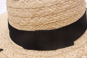British style raffia straw sun hat with black ribbon detail for summer beach vacations