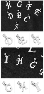 Detail view of silver stainless steel alphabet pendants A to I on dark leather background