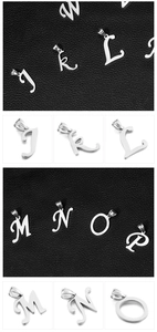 Detailed close-up of stainless steel alphabet pendants J to P in silver finish