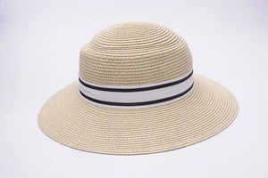 Women's wide brim straw sun hat with elegant black-striped white ribbon for beach wear