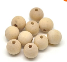 Close-up of 10 natural unfinished wooden beads with pre-drilled holes for DIY jewelry
