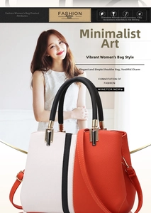 Detail of tricolor leather tote bag showing black, white, and orange pebbled texture