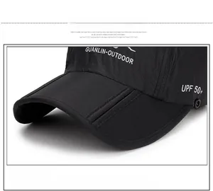Detailed macro view of black UPF 50+ sun hat with durable snap button and textured fabric