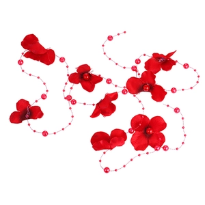 Detailed macro of red silk bridal flowers with faux pearls for wedding hair styling