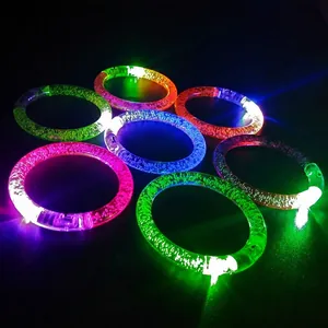 Colorful LED acrylic bubble bracelets glowing in various neon colors on a dark background